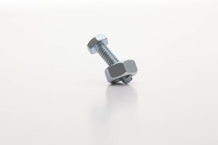 Chrome bolts   nuts aligned, isolated on white