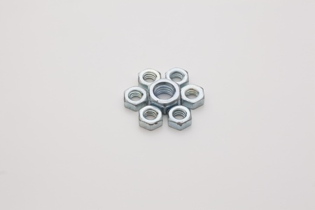 Chrome nuts aligned, isolated on white