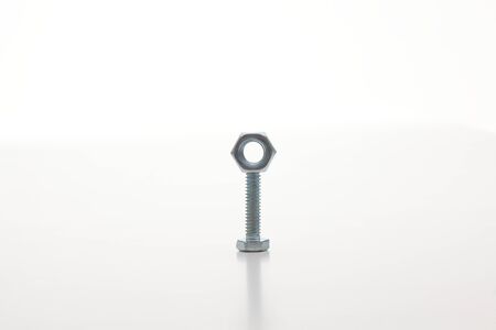 Chrome bolts   nuts aligned, isolated on whiteの写真素材