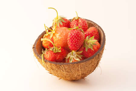 Red strawberry placed in the coconutの写真素材