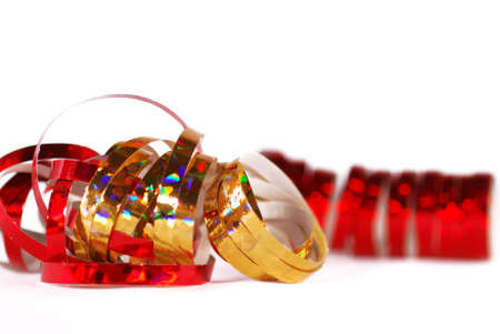 Red and gold serpentines on white backgroundの写真素材