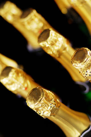 Champagne bottles in gold foilの写真素材
