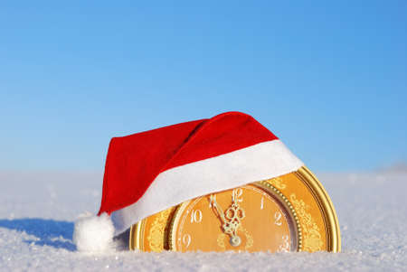 Clock showing the arrival of  new year on winter background