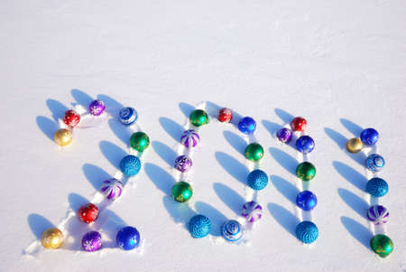 New year 2011 on snow backgroundの写真素材