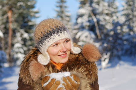 Woman  portrait with  winter background out of focusの写真素材