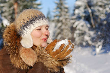 Woman  portrait with  winter background out of focusの写真素材