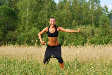 Young attractive woman doing morning sports exercisesの写真素材