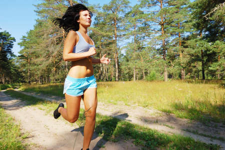 Young attractive girl running on the morningの写真素材