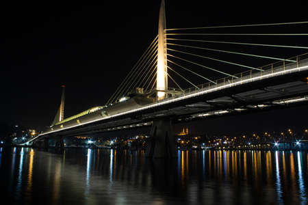 Long exposure photography of HaliÃ§ Metro Bridge in Ä°stanbul, Turkey. The lights of the bridge is shining onto the Marmara sea.の写真素材