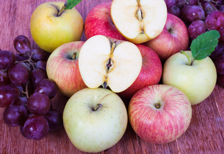 mixed set of fresh raw ripe fruits apple grapeの写真素材