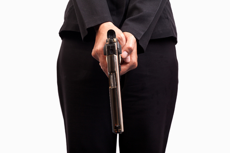 Close up of woman in business suit holding a gunの写真素材