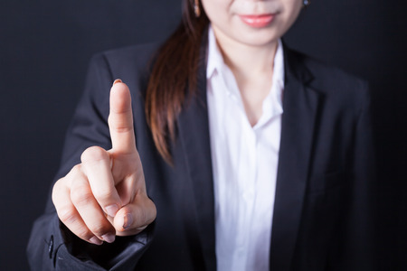 Businesswoman in front of visual touch screenの写真素材