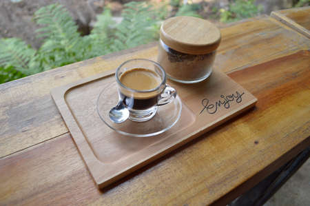 Cup of coffee on wooden tableの写真素材