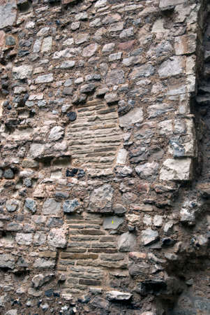 Closeup of an old historic wall with old and different bricksの写真素材