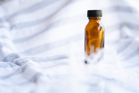 Mock-up amber glass bottle on white backgroundの写真素材