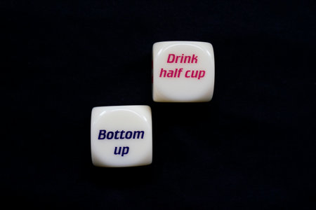 Drinking dice game isolated on black background