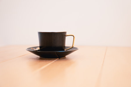 Coffee cup on wooden table in coffee shop - vintage effect style picturesの写真素材