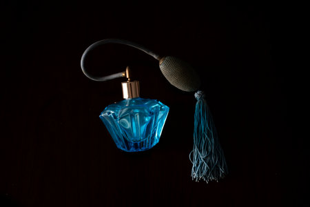 Perfume bottle on a black background. Perfumery