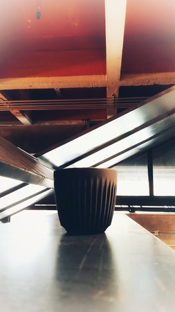 Black coffee cup on a table - Vintage filter effect