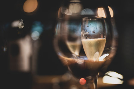 Glass of champagne with bokeh background,vintage color toneの写真素材