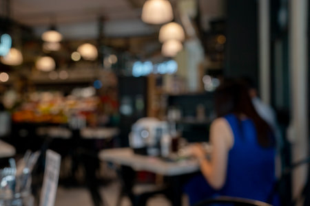 Blurred background of coffee shop or cafe with bokeh image.の写真素材