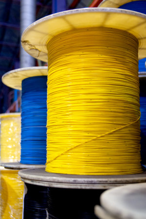 Group of fiber optic cable reels with intertwined optical fibersの写真素材