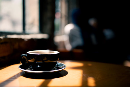 Coffee cup on wooden table in coffee shop, stock photoの写真素材