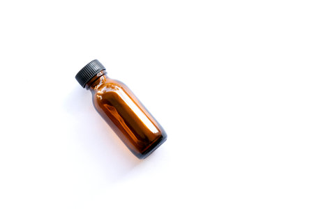 A bottle of essential oil isolated on white background. Essential oil bottleの写真素材