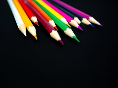 Multi colour pencils on black backgroundの写真素材