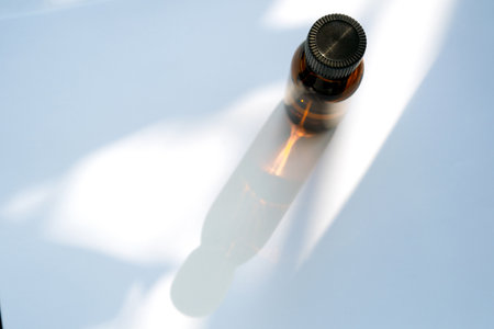 Amber glass bottle isolated on white backgroundの写真素材