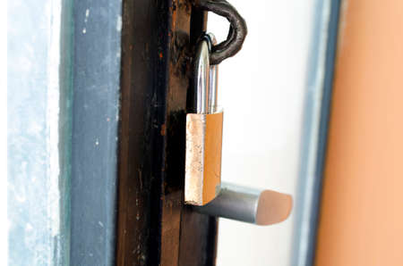 Rusty Padlock and old door handle