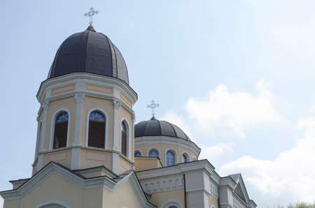 Bulgarian church with cross on blue sky