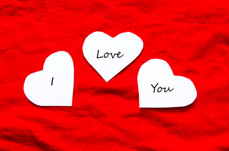 Valentines day card with three hearts and place for text の写真素材