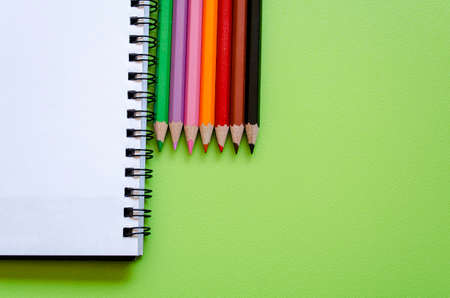 Colorful pencil crayons on a green , back to schoolの写真素材