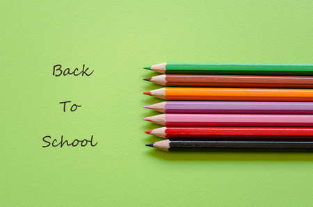 Colorful pencil crayons on a green , back to schoolの写真素材