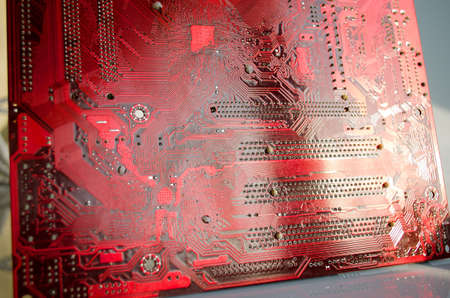 Closeup of a red printed circuit boardの写真素材