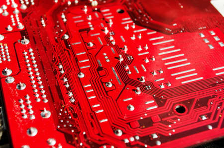 Closeup of a red printed circuit boardの写真素材