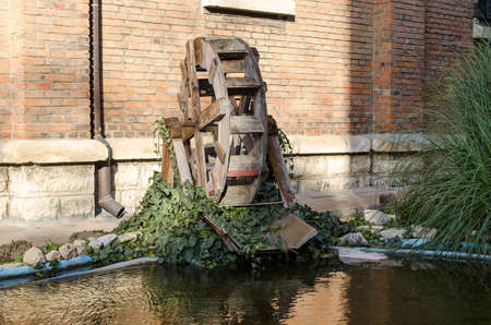 Wooden wheel of an old water millの写真素材