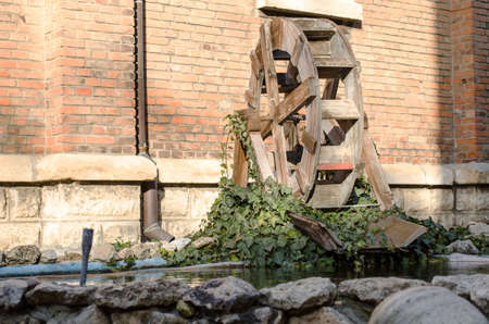 Wooden wheel of an old water millの写真素材