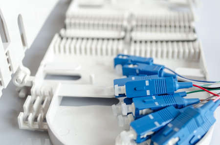 Fiber optical patch cord with plugs isolated on white backgroundの写真素材