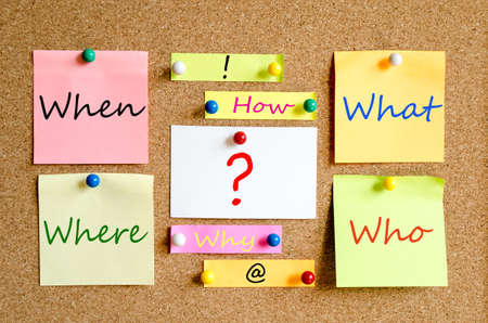 Colorful sticky notes on cork board background questions Conceptの写真素材