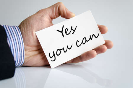 Business man hand writing Yes you canの写真素材