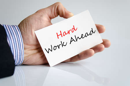 Hard work ahead hand concept isolated over white backgroundの写真素材