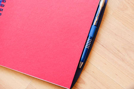Red notepad and place for conceptual textの写真素材