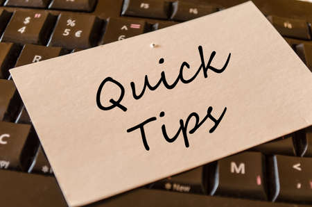 Quick tips text concept note on dark keyboard backgroundの写真素材