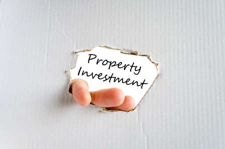 Property investment text concept isolated over white backgroundの写真素材