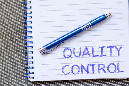Quality control text concept write on notebook with penの写真素材