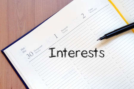 Interests text concept write on notebook with penの写真素材