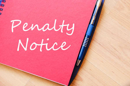 Penalty notice text concept write on notebookの写真素材