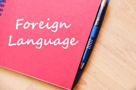 Foreign language text concept write on notebook with penの写真素材